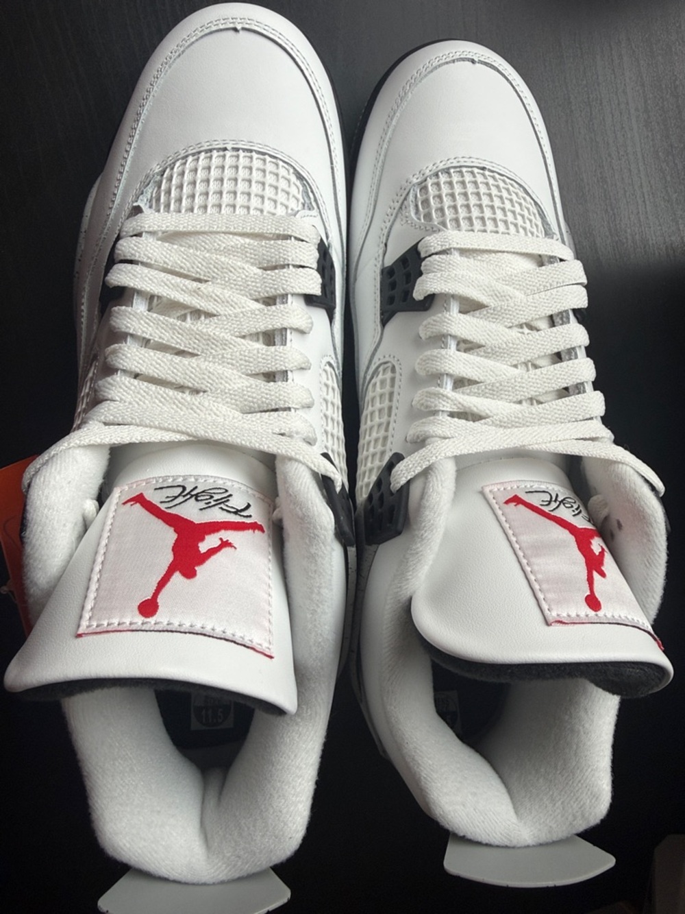 Jordan White Sneakers with Red Jumpman
Cement 4s brand new size 11.5
With Box